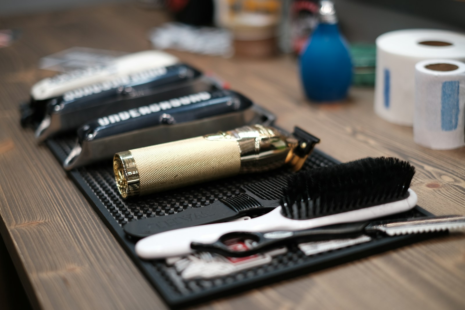 a close up of a table with a hair brush and a pair of scissors